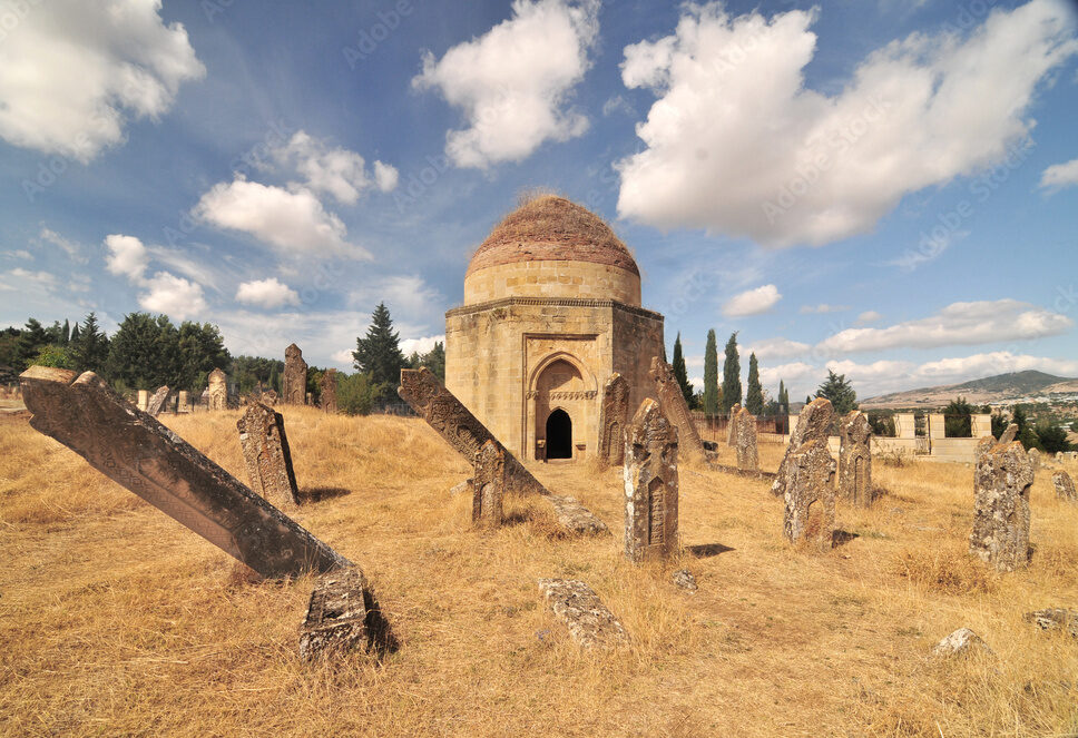 Ancient domed mausoleums known as Yeddi Gumbaz located on a hillside in Shamakhi, Azerbaijan.