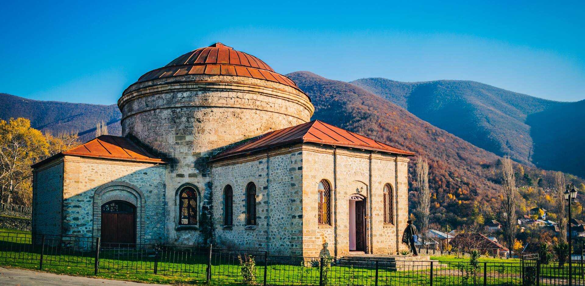 Explore Sheki’s beautiful streets framed by the Greater Caucasus Mountains.