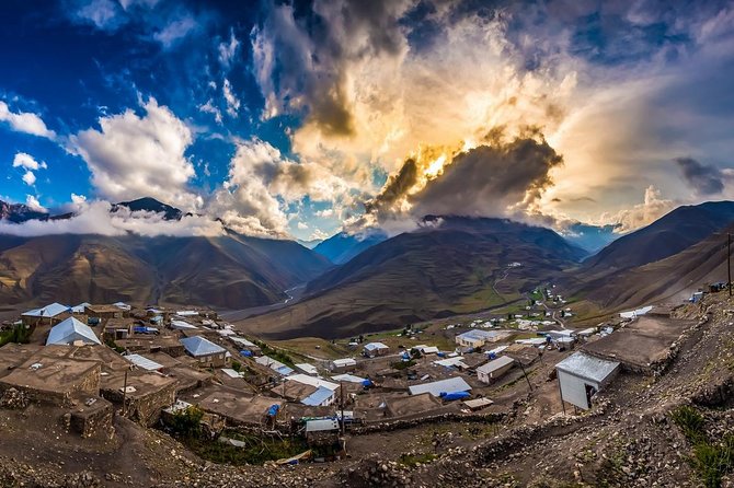 A stunning view of the sun setting behind the hills